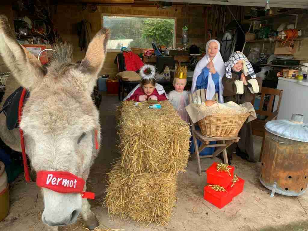 Family nativity scene with donkey