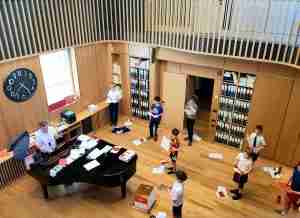 e of the Bath Abbey Boys Choir and Huw Williams, Director of Music, during practice session in Song School