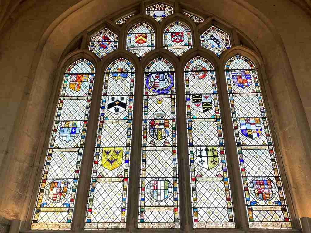 Stained glass window in Bath Abbey depicting family crests