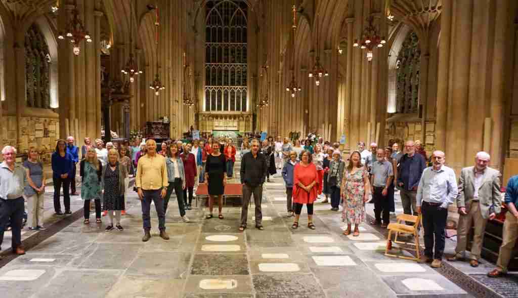 Group of singers attending the Soul Soundings workshop stood in Bath Abbey