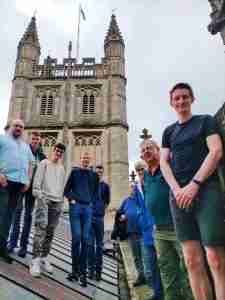 Group of bell ringers stood on Bath Abbey roof