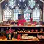 Shop display featuring Tudor-related products including magnets and books.