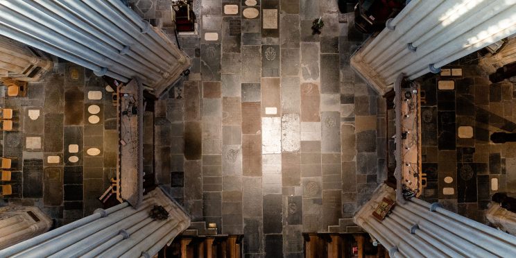 View looking down to Bath Abbey's floor covered in ledgerstones from the trapdoor in the tower
